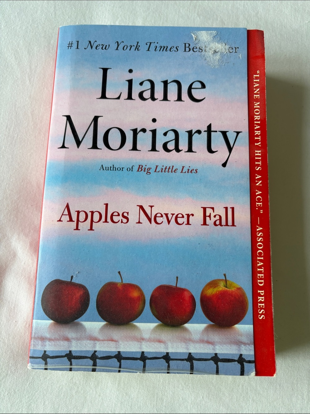 Liane Moriarty "Apples Never Fall" Paperback - Blue & Red Cover